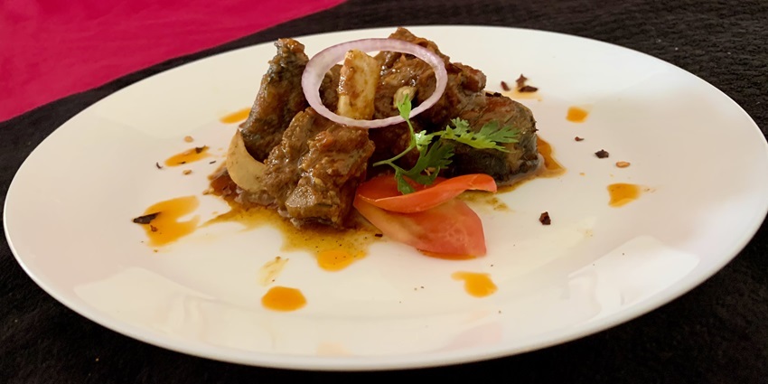 An image of the tasty Kongu Mutton Chukka, one of the dishes you must try in Coimbatore