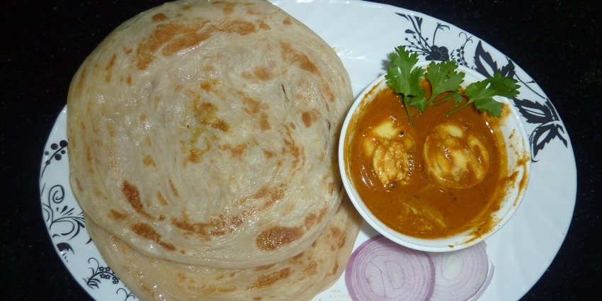 Shredded flatbread stir-fried with eggs, vegetables, and spices.