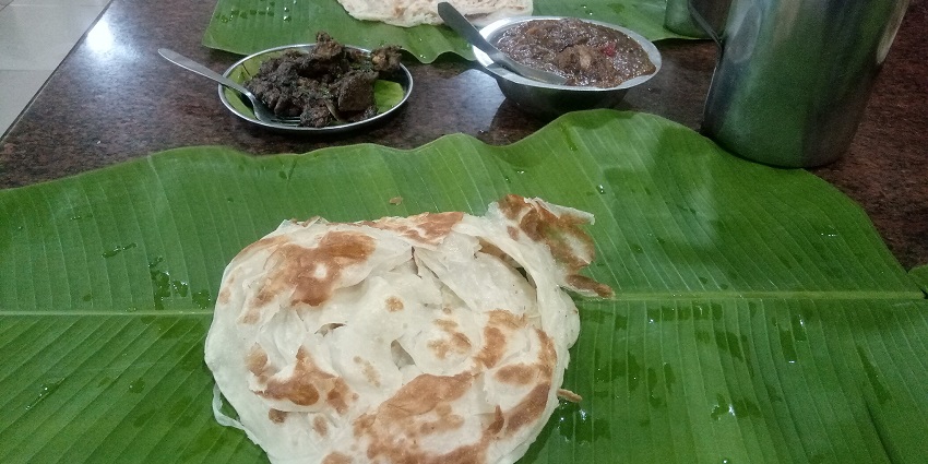 A glimpse of a stir-fried parotta with meat, vegetables, and flavorful spices in Madurai.