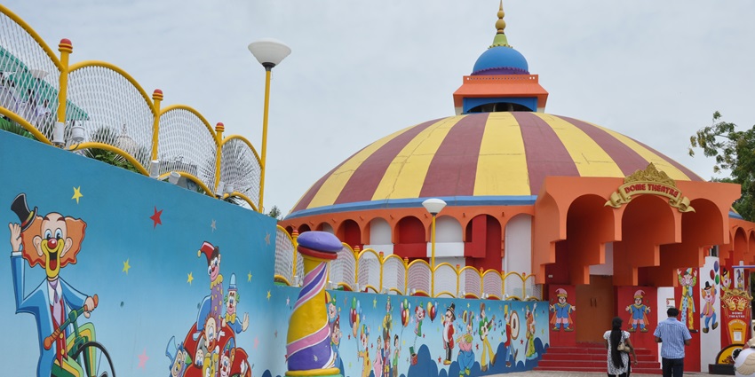 Kids and adults have fun at an amusement park, one of the best places to visit in coimbatore