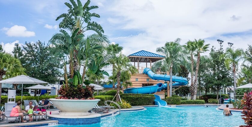 A lively view of Krishna Water Park featuring various water slides, pools, and roller coasters