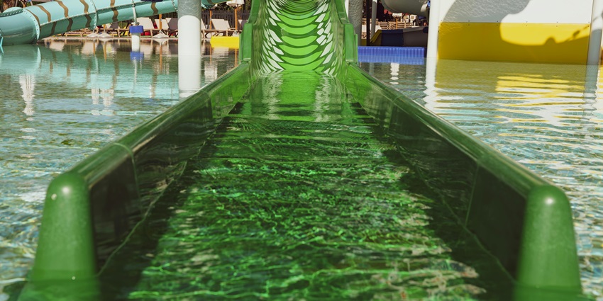 An view of a vibrant water park featuring slides and pools filled with visitors.