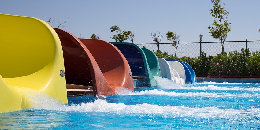 A vibrant water park featuring twisting water slides, a perfect place for a weekend getaway.