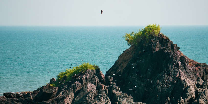 A scenic view of the vast sea taken from the shore of Kudle beach