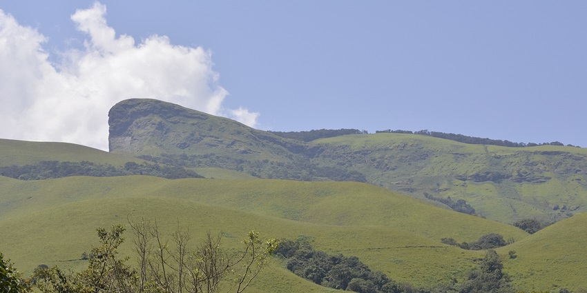 Tourist places in Kalasa feature Kudremukh Peak, a challenging trek with panoramic views and nature.