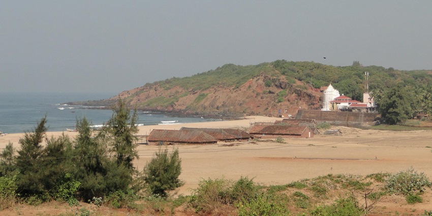 Image showcasing the beautiful landscape surrounding the Kunkeshwar Temple near the sea