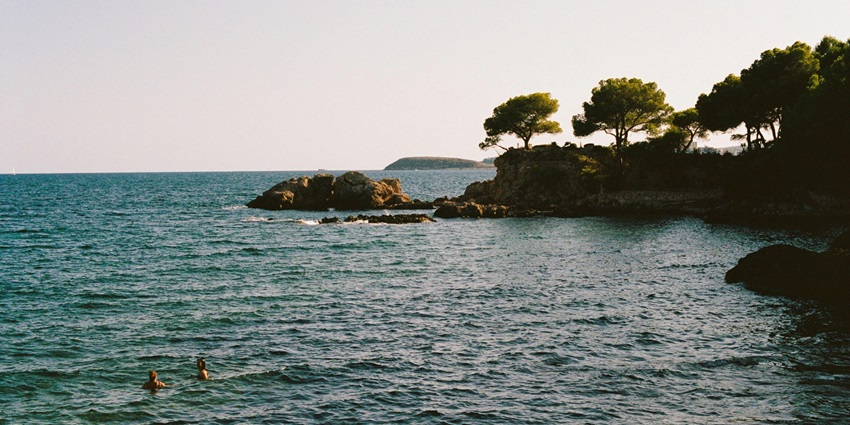 A picture of pristine Kurusadai Island shot from the coastline, known for its marine life.