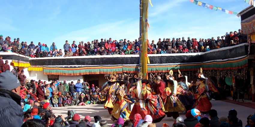 A picture of people enjoying the Ladakh Harvest Festival with traditional dances and dishes