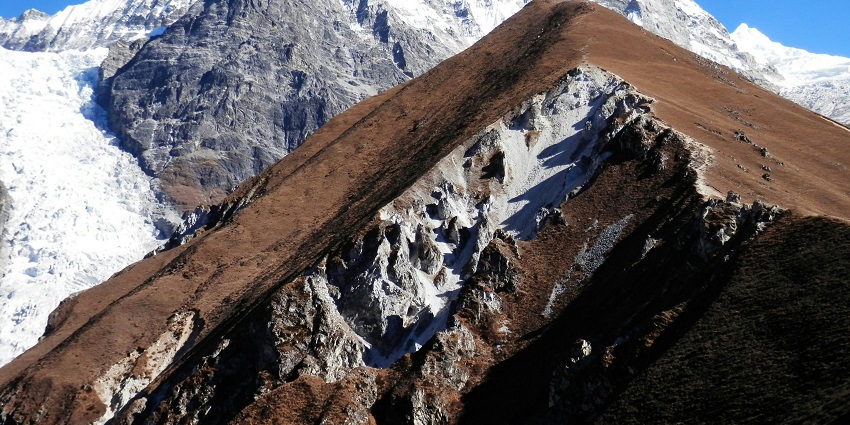 The magnificent view of mountains in Leh, Ladakh covered in a thick blanket of white snow.