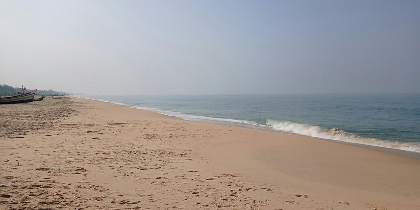 Peaceful shores of Ladghar Beach with gentle waves, among top places to visit in Dapoli.
