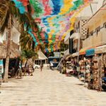 Shops selling marine-themed souvenirs like shell decorations and wooden artefacts.