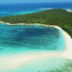 Picturesque view of Lakshadweep Islands with aerial view of turquoise colour water and greenery island