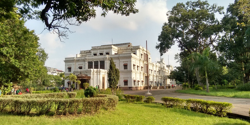 The opulent ballroom of Lal Bagh Palace, adorned with chandeliers and royal deco