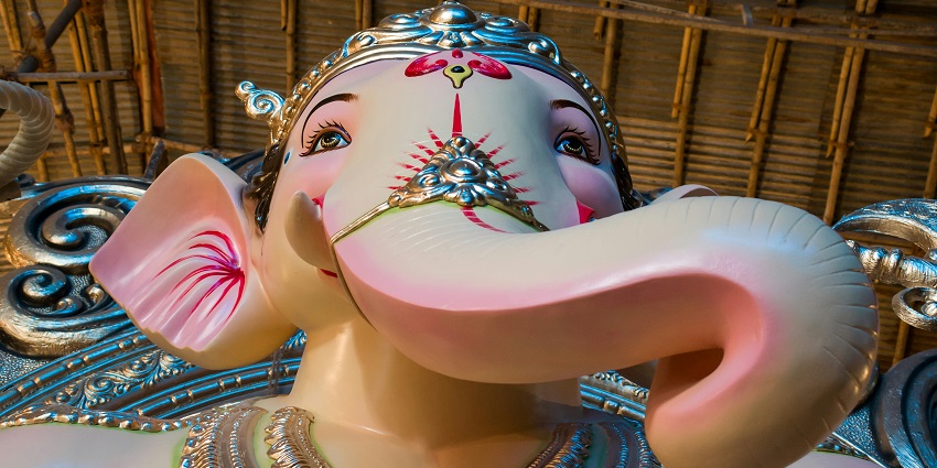 A closer look at the majestic idol of God adorned with beautiful shades and gold jewels.