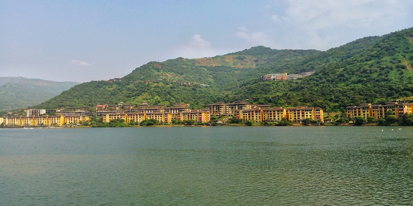 An enchanting view of glistening blue waters and green majestic mountains of Lavasa.