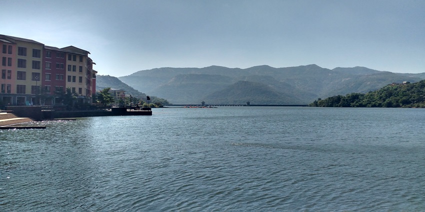 Image of a Lake with hills at the background under clear beautiful sky view