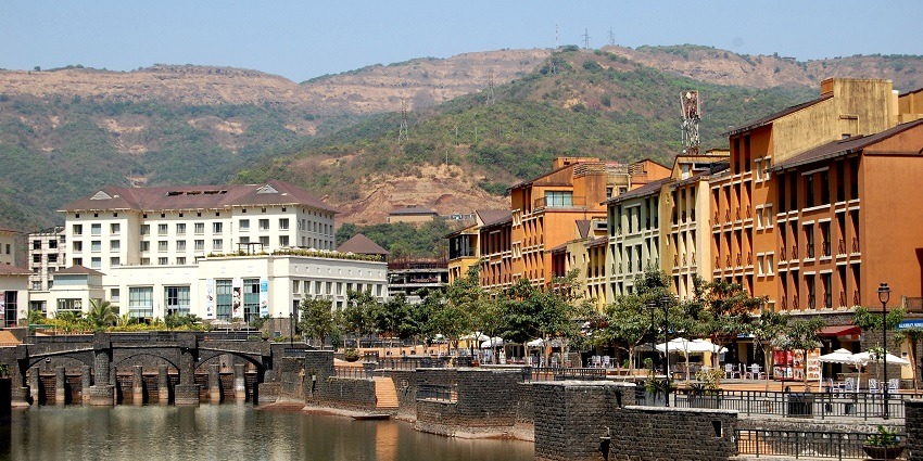 View of Lavasa Hills showcasing its scenic hills under a clear blue sky and bright sunlight.