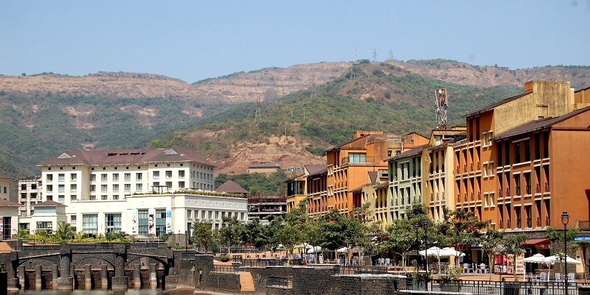 A picture of Lavasa hill city with European-style buildings attracting many visitors.