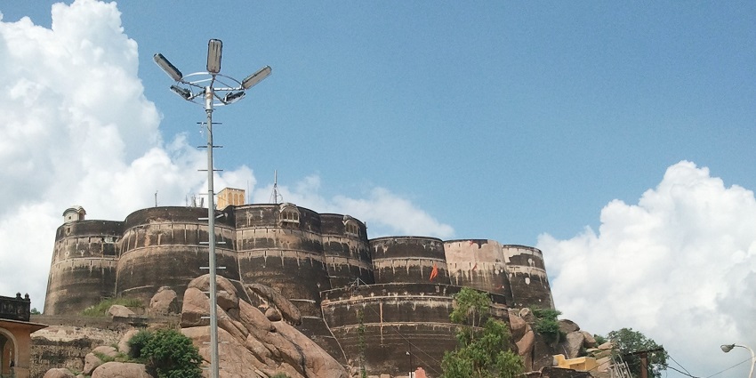 Laxmangarh Fort on a hilltop in Sikar with its rugged stone architecture and surroundings.