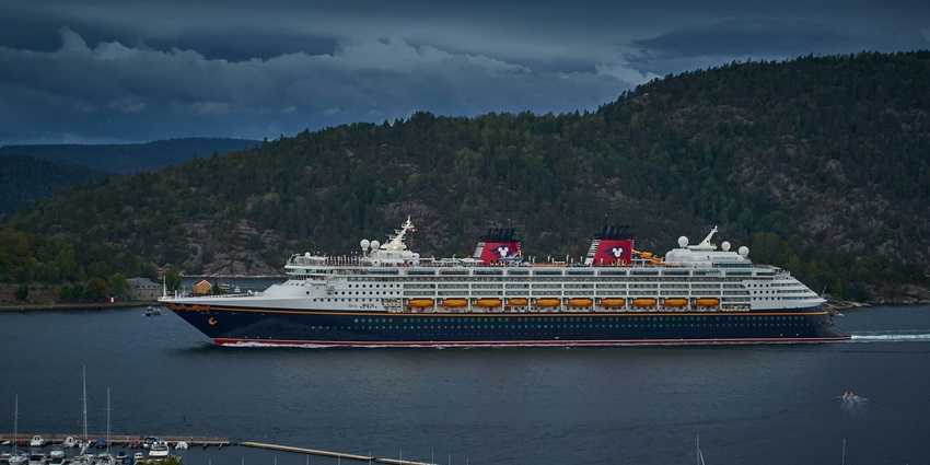 A view of a majestic ship sailing through the glistening blue waters of the region.