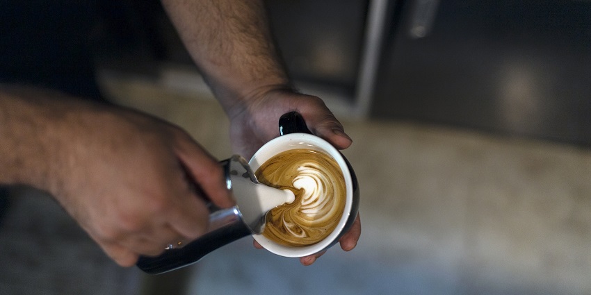 A steaming cup of coffee, perfect for a relaxing break or a morning boost.