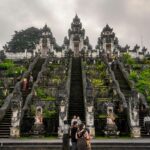 An image of a person standing at the entrance of the iconic Lempuyang Temple in Bali.