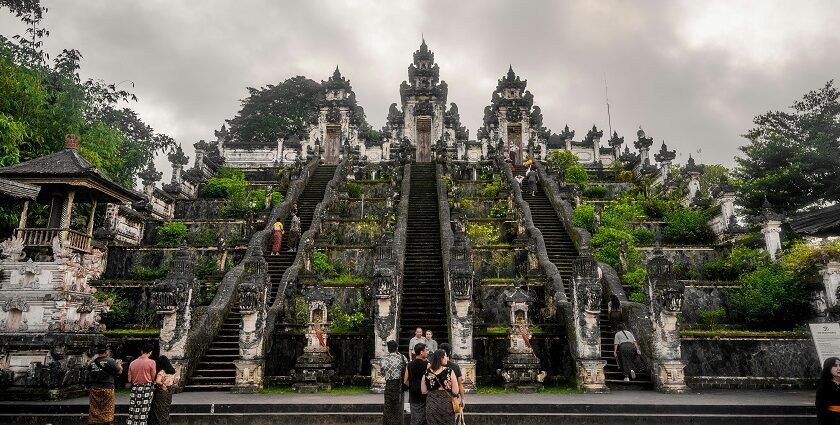 An image of a person standing at the entrance of the iconic Lempuyang Temple in Bali.