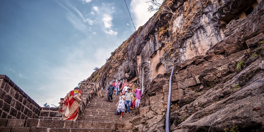 The panoramic view of the ancient Lenyadri Caves, a famous place near Shivneri Fort