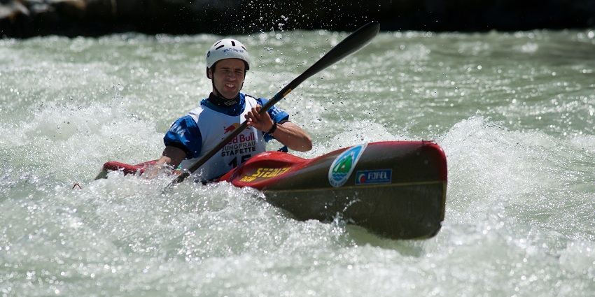 A kayaker navigating rough, whitewater rapids in Pune, Maharashtra.