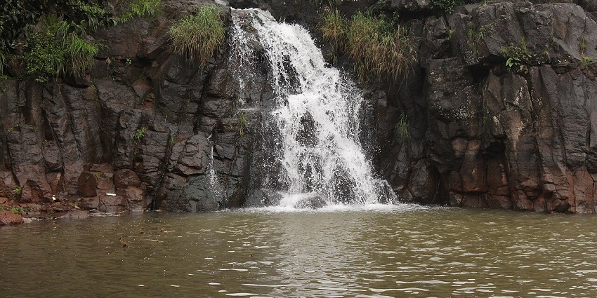 Lingmala Waterfall flows down rocky cliffs, surrounded by greenery and offers things to do in Panchgani.