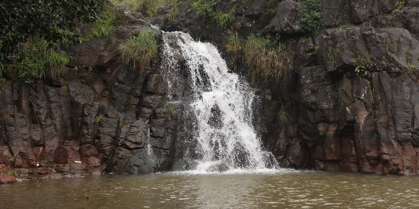 Lingmala Waterfall cascading down rocks, a popular destination near Sawatsada Waterfalls.