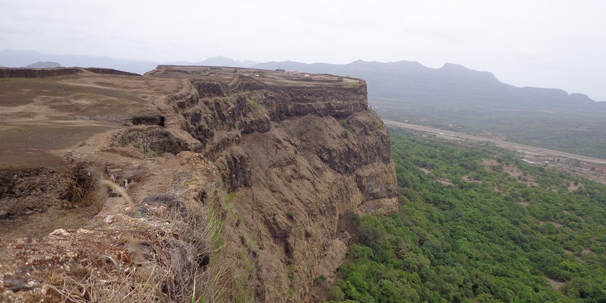 View of the walls of the Korigod fort at the cliff, fill of lush forest