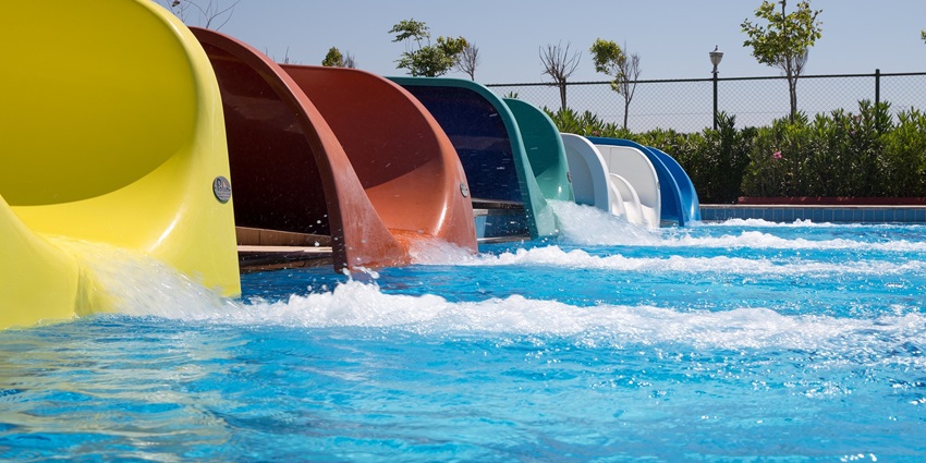 A vibrant view of Adventure Park Pushkar, showcasing thrilling rides and lush greenery.