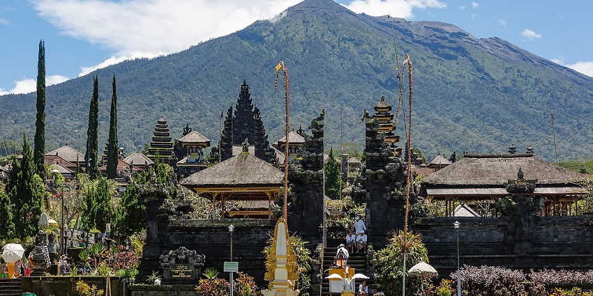 A picture of Besakih Temple in Bali, Indonesia, as seen with Mount Agung in the background