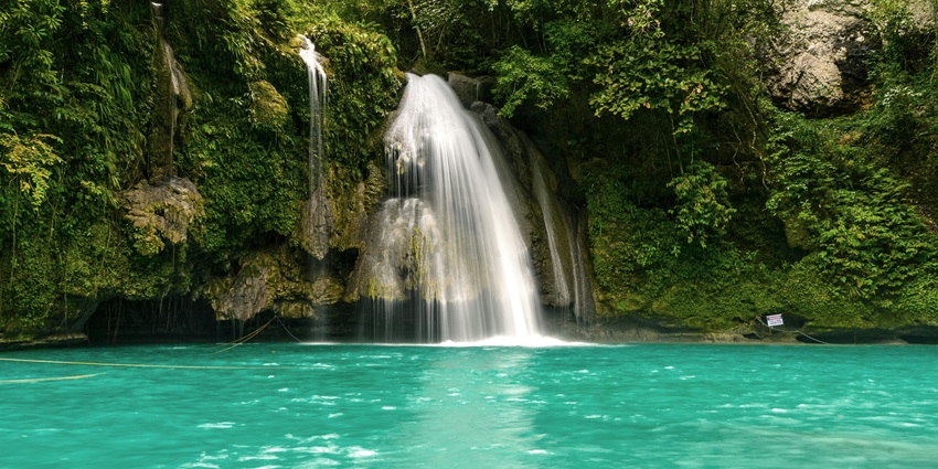 Zenith waterfall , surrounded by vibrant greenery and natural beauty