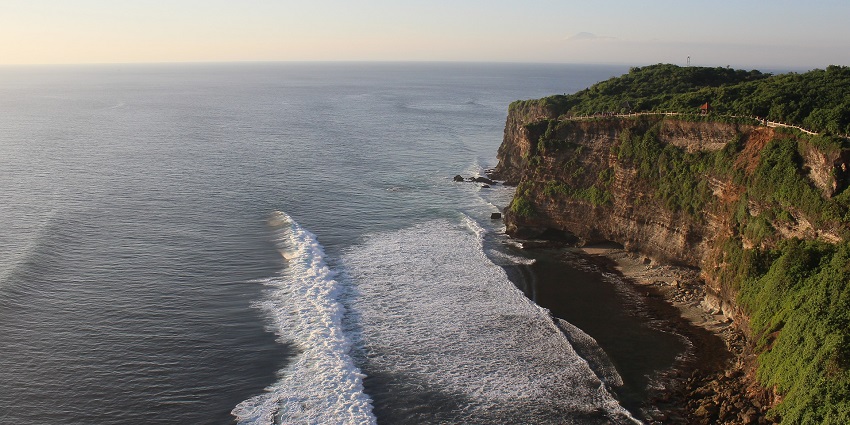 View of Uluwatu Temple in Bali and the expansive sea stretching out