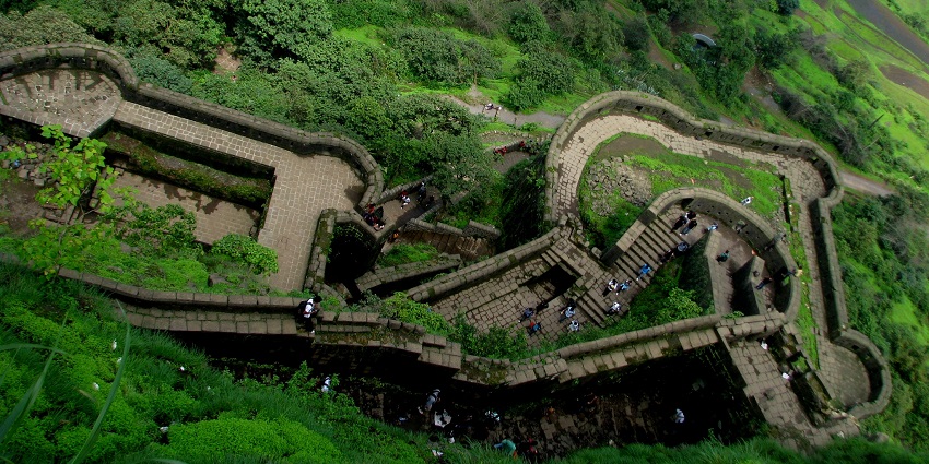 Narayangad Fort on the hilltop, offering breathtaking panoramic views.