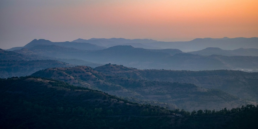 A scenic landscape justifying the serene location of Sinhagad Fort in Maharashtra.