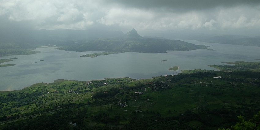 Kamshet features a green landscape and a vast lake in the middle of Tikona Fort and other hills