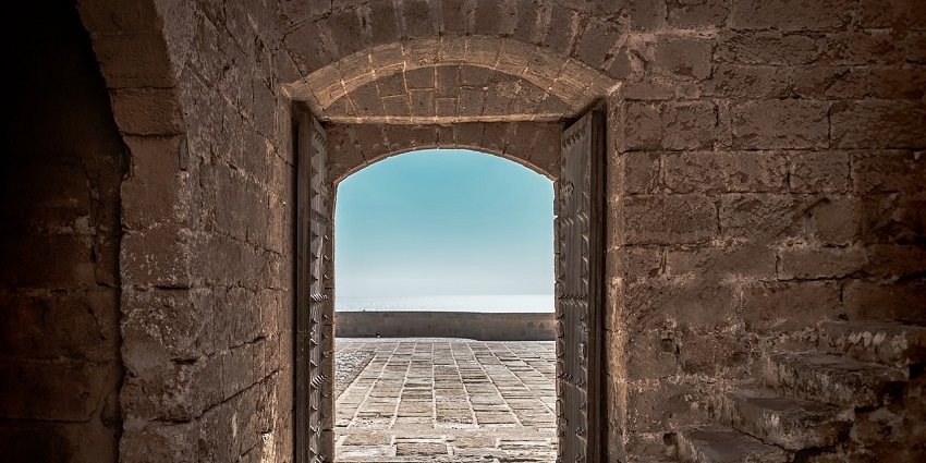 Old wooden door of the fort showcasing intricate architecture and weathered texture