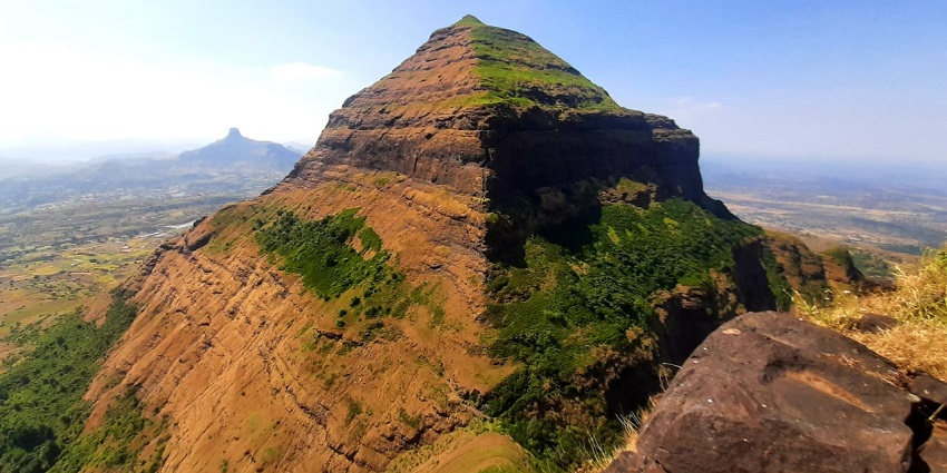 Landscape of Salher Fort showcasing the Parshuram Temple atop, framed by hills
