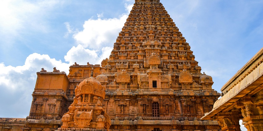 Detailed carvings on the temple top of Thirunallar Temple in Tamil Nadu