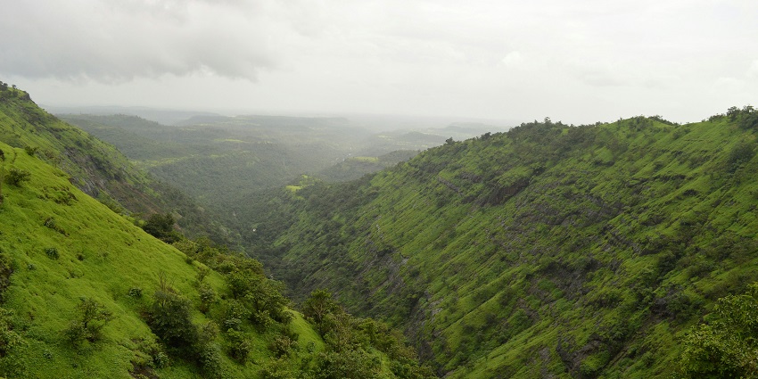 View of the top of Irshalgad Fort, showing rocky ground and clear skies