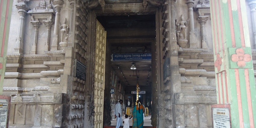 Entrance to the Palani Base Temple, featuring vibrant decorations and traditional architecture