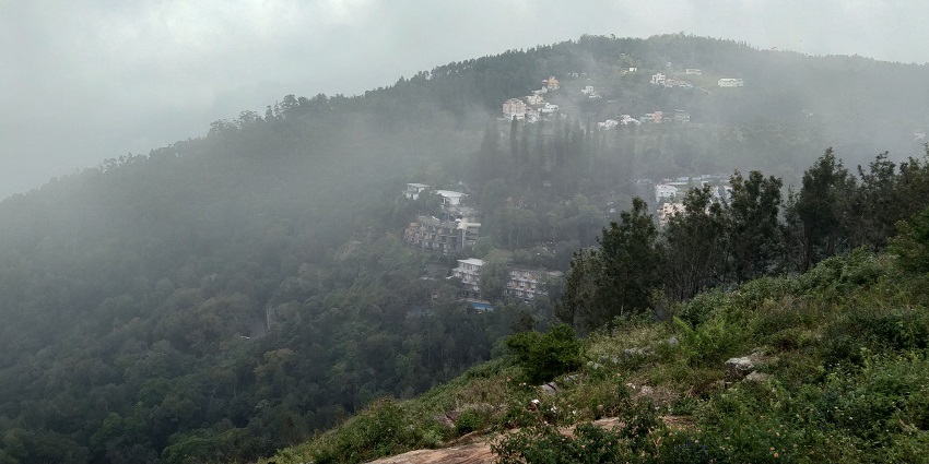 Serene view of Yercaud’s lush green hills and misty landscapes.