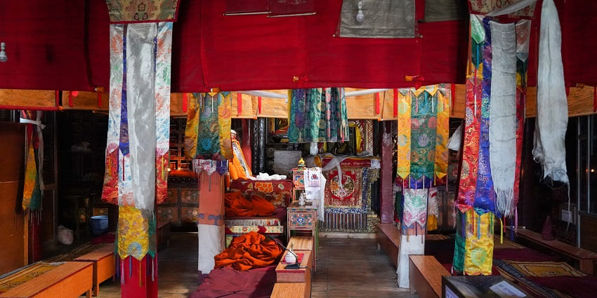 Snapshot from the inside of the prayer hall of Karsha Monastery in the dry hills of Ladakh