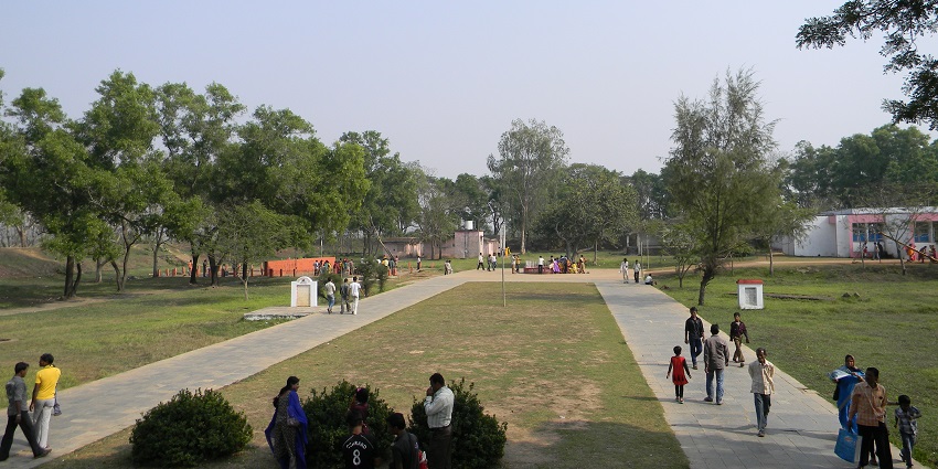 Inside of the Atri Hot Spring Complex filled with tourists walking on the pathway
