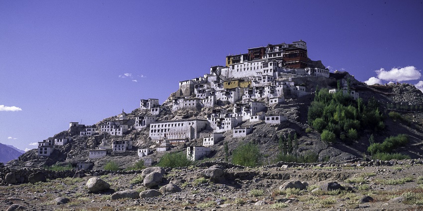 Panoramic view of the monastery on a hill surrounded by lush trees