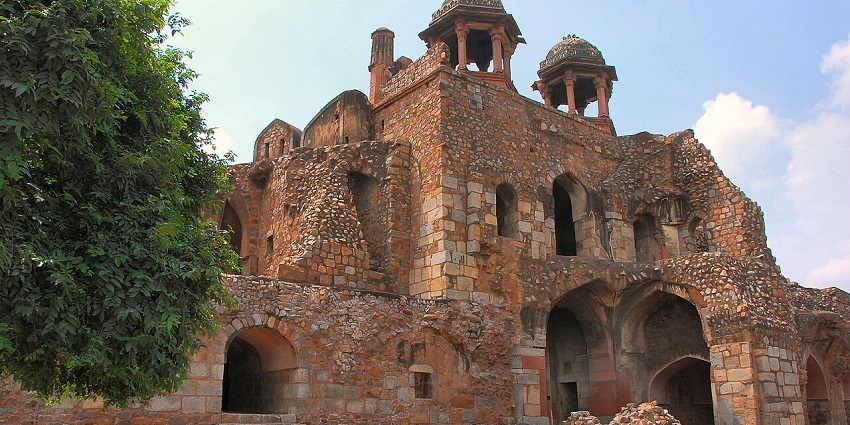 A picture of the ruins of an old fort with traditional architecture visible