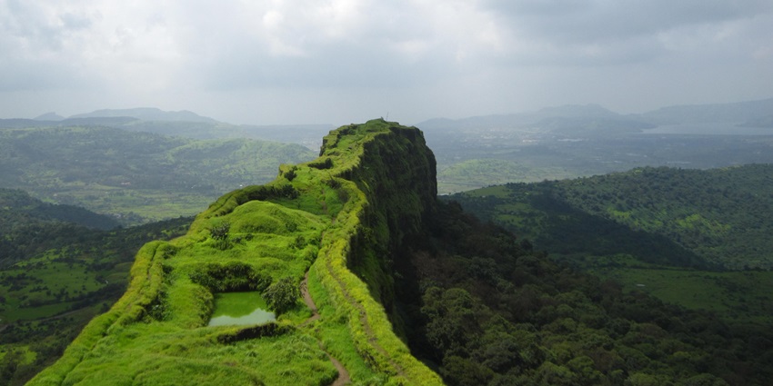 Lohagad Fort, featuring ancient stone structures, offers breathtaking panoramic views.